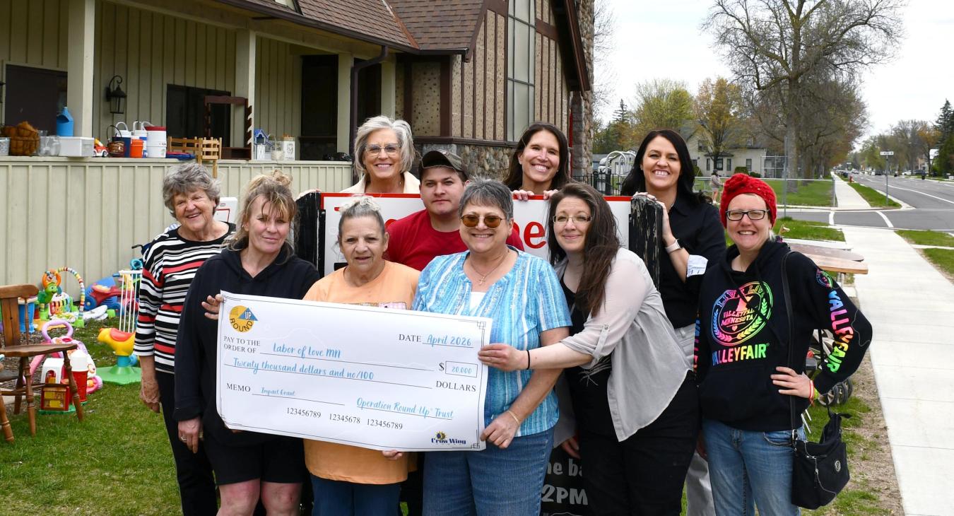 photo of mn labor of love accepting check